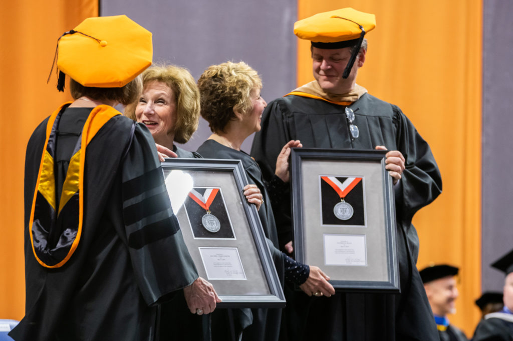 Rachel Tobin-Smith and Pattie Hays receiving the Indiana Tech President’s Medal in honor of their service to the community