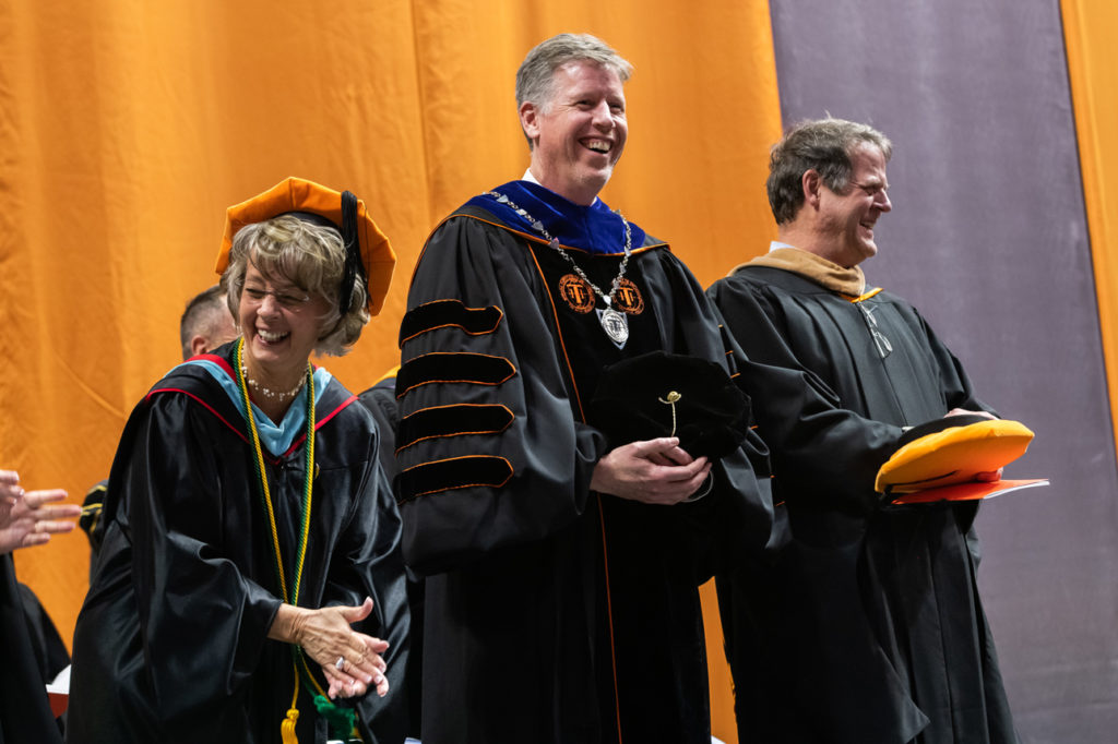 Sherrill Hamman and President Einolf sharing a funny moment at commencement