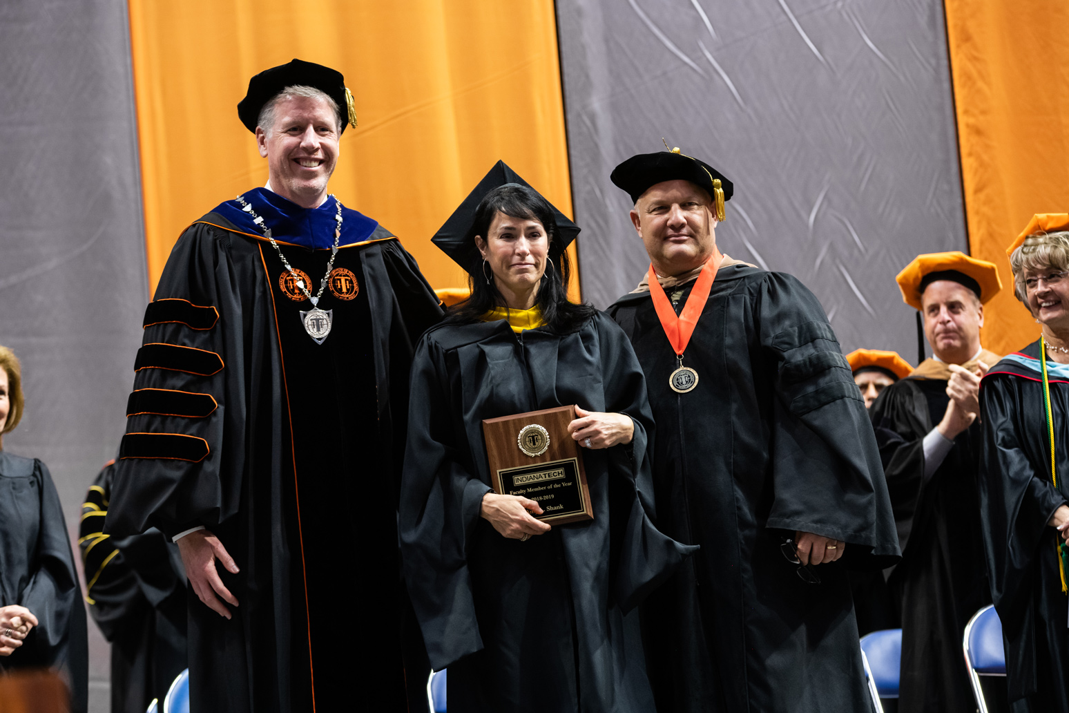 Assistant Professor of Biology Amy Shank, middle, stands with President Einolf, left, and Vice President for Academic Affairs Dr. Tom Kaplan after earning the 2019 Faculty of the Year award.