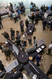 An overhead view inside the Multi-Flex Theater of the Showcase of Senior Projects and Technology.