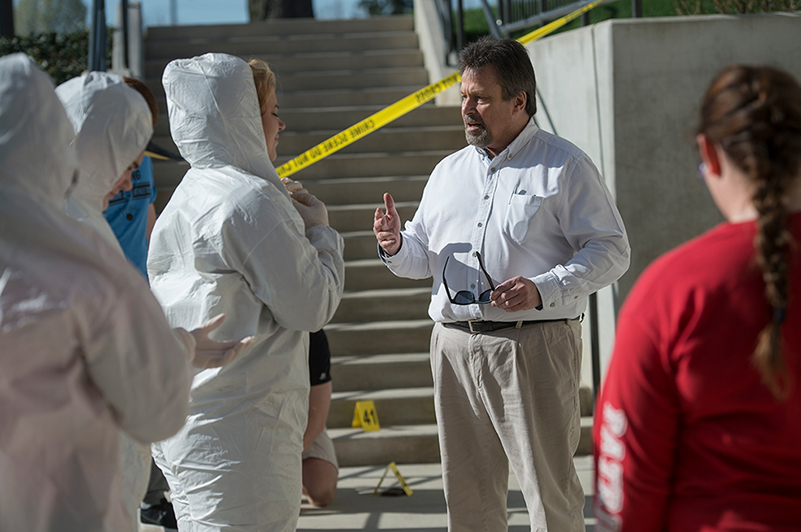 Dominic Lombardo, associate professor and director of Indiana Tech’s Center for Criminal Justice leading a class