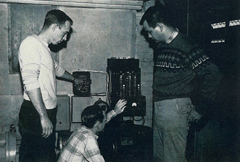 Richard D. Dermer and students testing a voltage regulator for a motor generator