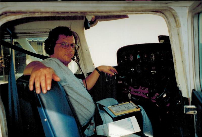 Mauricio Torres sitting the pilot seat of an airplane