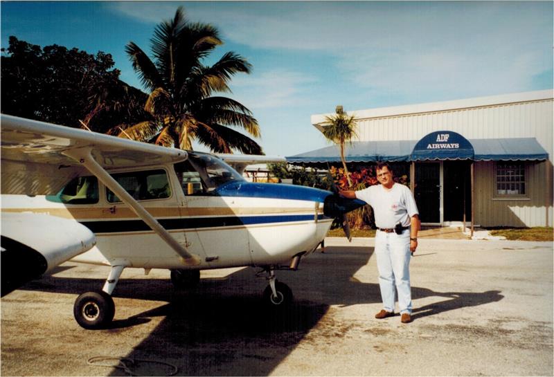 Mauricio Torres standing next to a plane