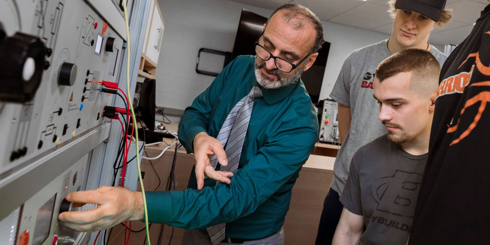 Dr. Al-Hamouz Demonstrating Electrical Engineering Equipment