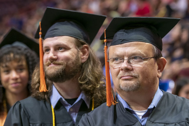 Father and Son walking at commencement