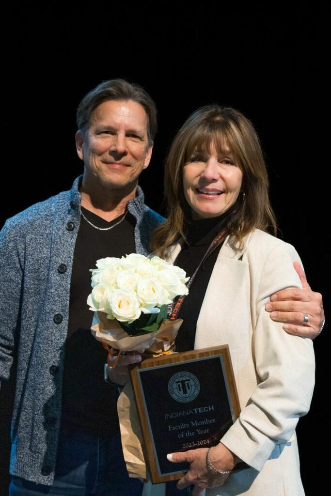 Sharon Drapala receiving faculty of the year award